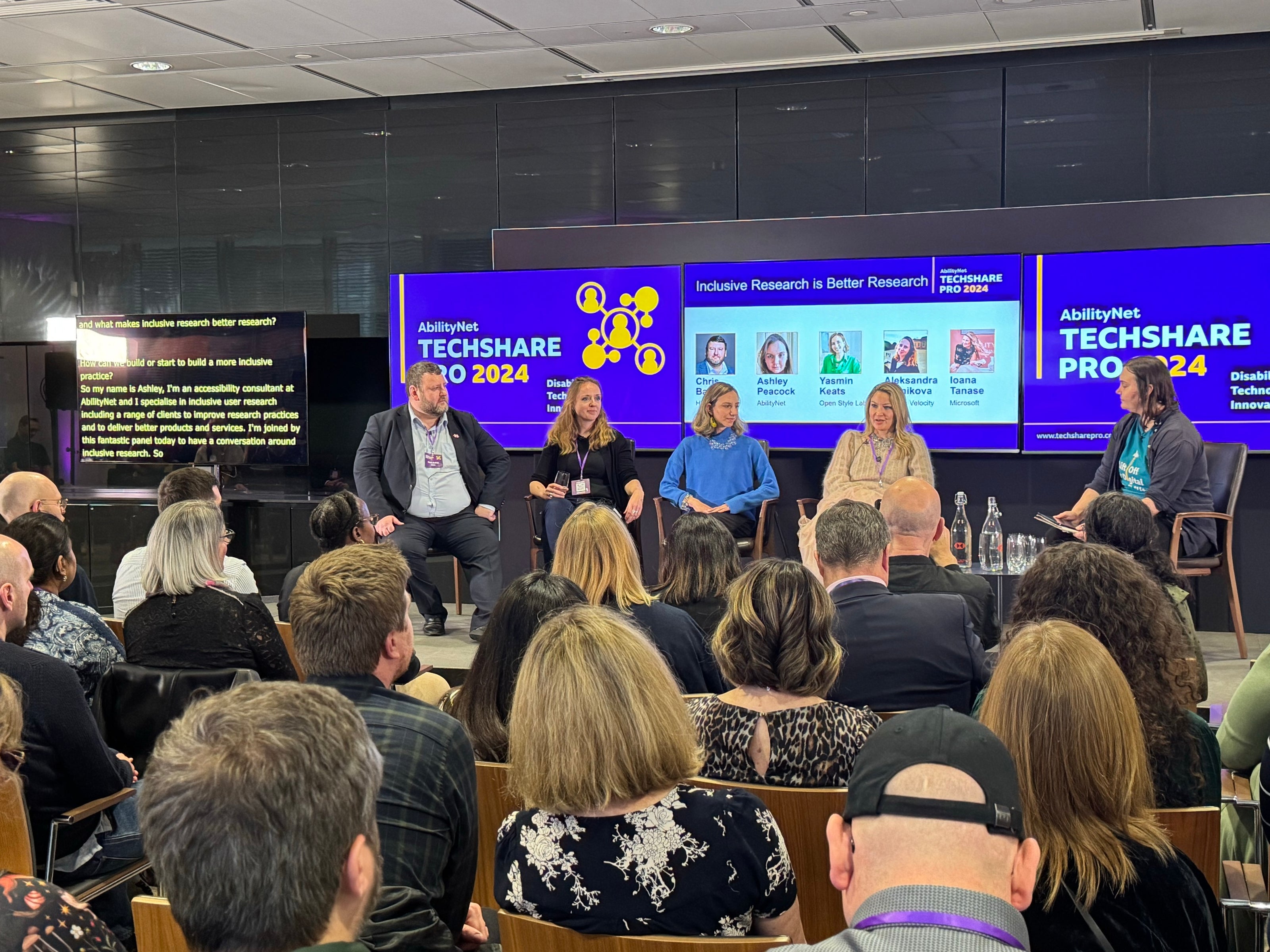 Ioana and four other panelist at TechShare Pro 24 in front of a busy room of people 