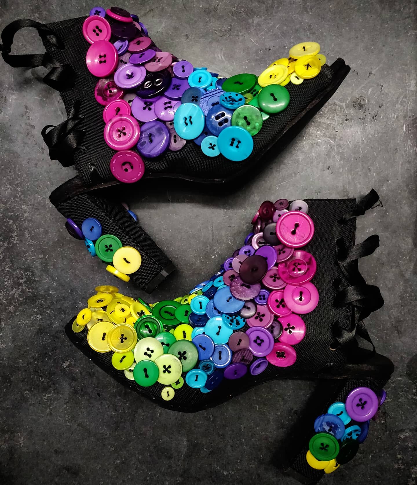 Lateral view showcasing a playfulness of buttons. They can be styles with both pants, skirts and dresses. They are not meant to be casual and they are meant to stand out