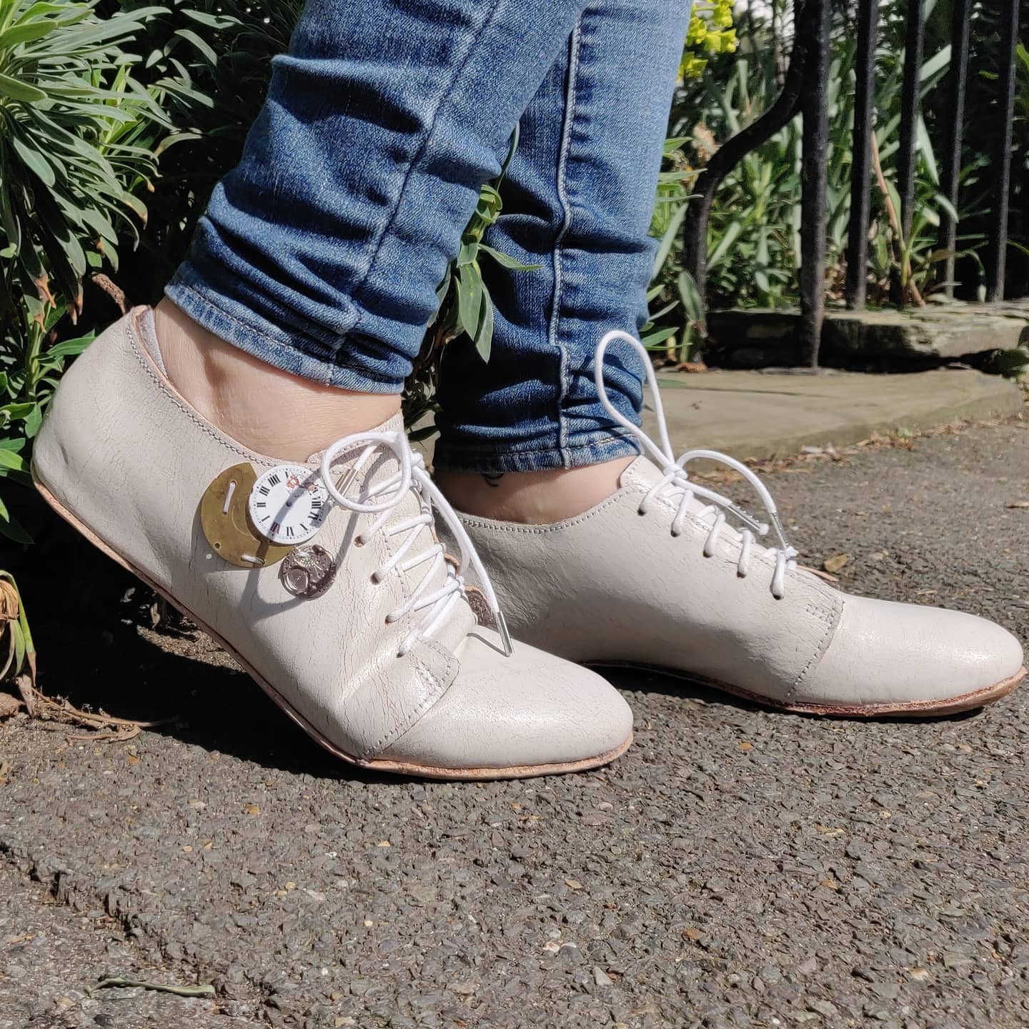 Modelling the shoes with blue jeans for a casual look 