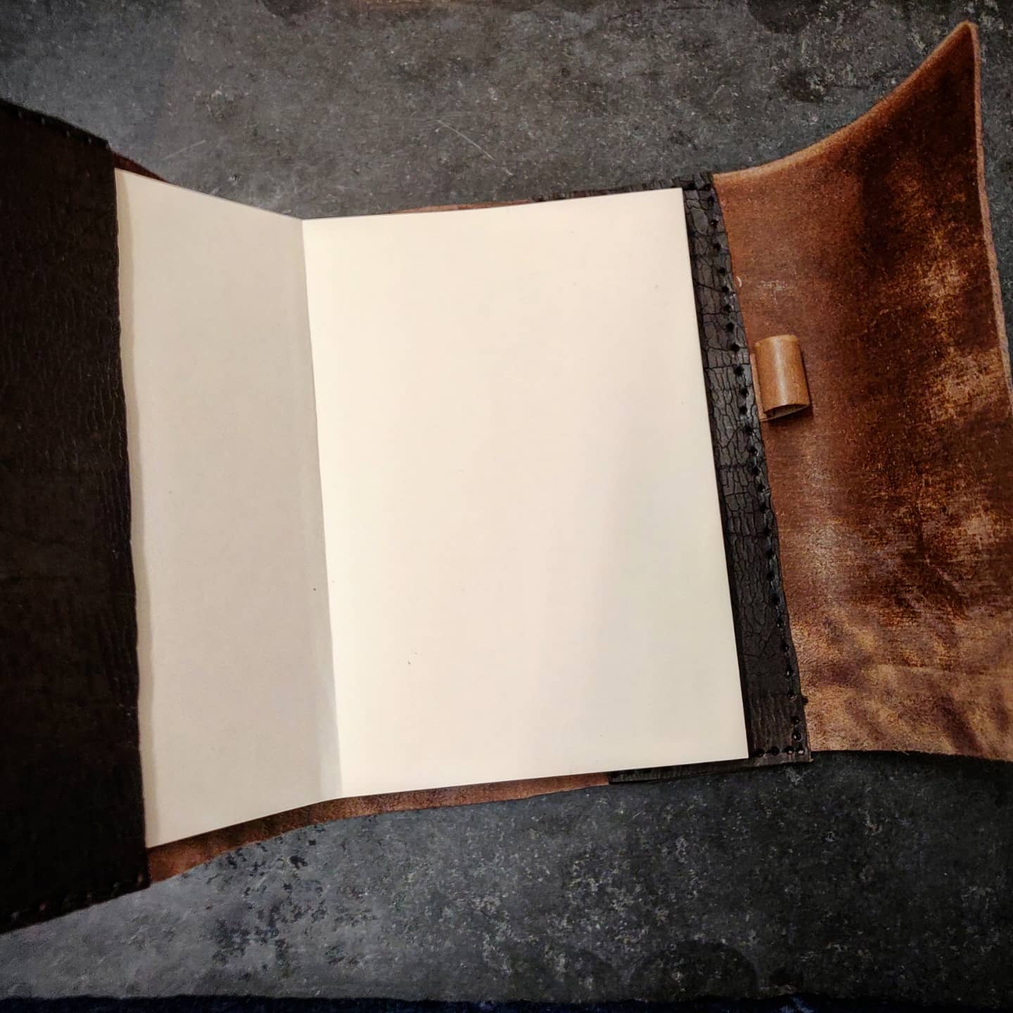 Opened journal to showcase pen holder on right hand side