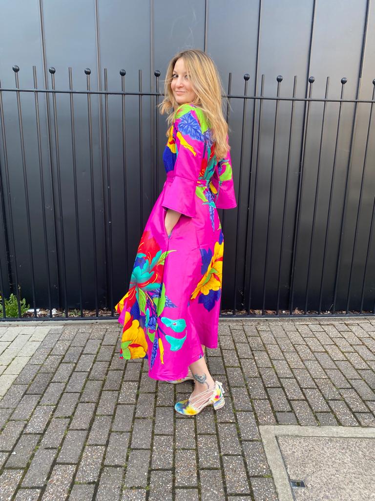 Myself modelling the shoes with with a very colorful fuchsia dress, showing color and color does work