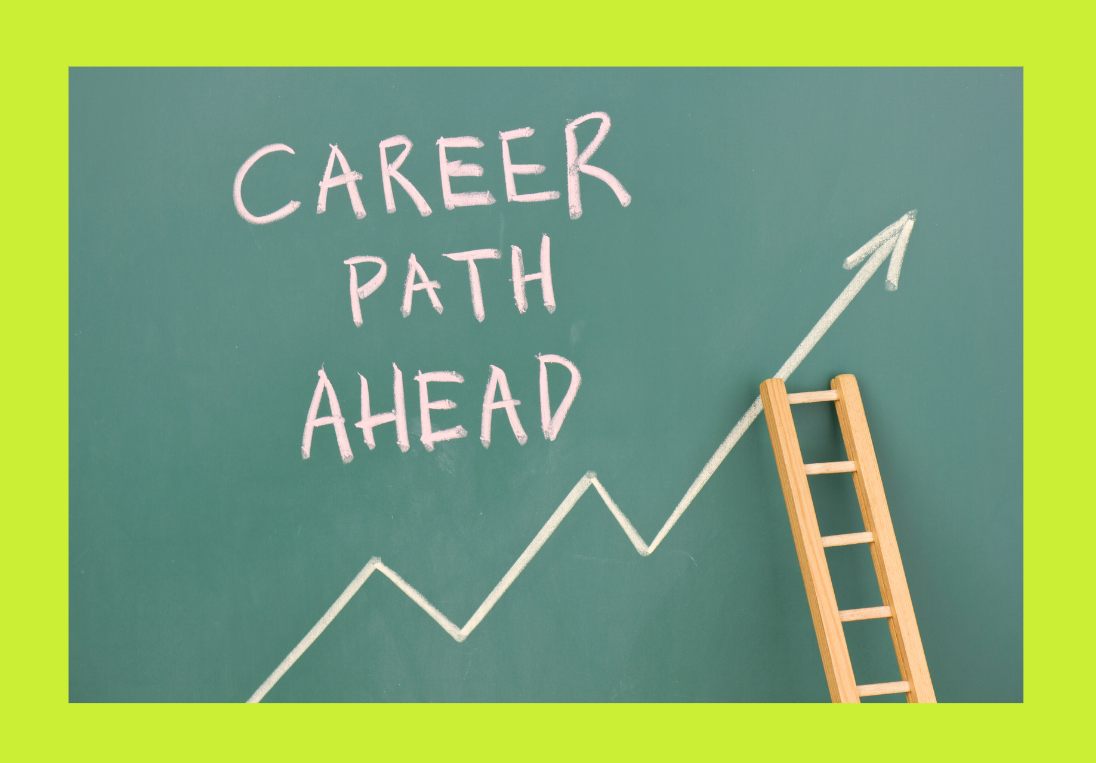 A wood ladder next to a board with chalk text stating career path ahead and an arrow pointing up