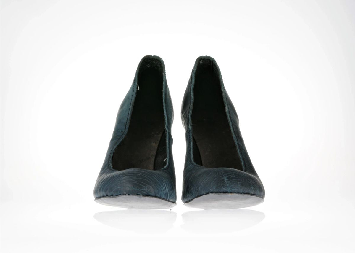 Front view of the shoes showcasing the nice contrast between the silver soles and blue leather of the upper 